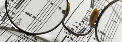 Some glasses on a sheet of music